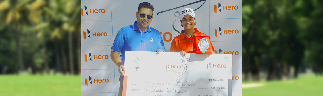Ms. Hitaashee Bakshi receiving winner's cheque and trophy from Mr. Tusch Daroga, AVP Ops-DLF G&CC.