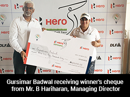 Gursimar Badwal receiving winner's cheque from Mr. B Hariharan, Managing Director