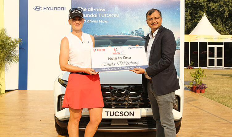 Linda Wessberg of Sweden with her hole in one prize