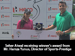 Seher Atwal receiving winner's award from Mr. Hamza Yunus, Director of Sports-Prestige