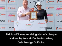 Ridhima Dilawari receiving winner's cheque and trophy from Mr Declan Mccollam, GM- Prestige Golfshire.