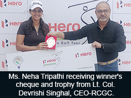 Ms. Neha Tripathi receiving winner's cheque and trophy from Lt. Col. Devrishi Singhal, CEO-RCGC.