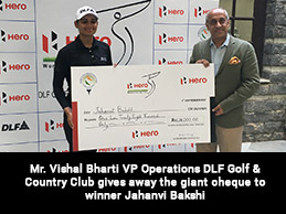 Mr. Vishal Bharti VP Operations DLF Golf & Country Club gives away the giant cheque to winner Jahanvi Bakshi