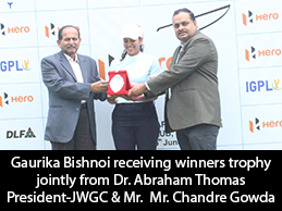 Gaurika Bishnoi receiving winners trophy jointly from Dr. Abraham Thomas President-JWGC  Mr. Chandre Gowda Chairman-MRC Ltd.