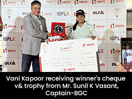 Amandeep Drall receiving giant cheque from Dr. Abraham Thomas-President, JWGC